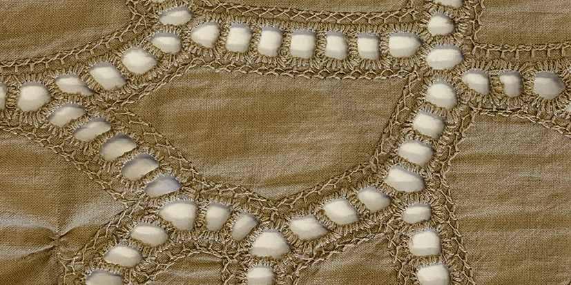 100% broderie anglaise cotton cargo trousers with side pockets and drawstring at the hem