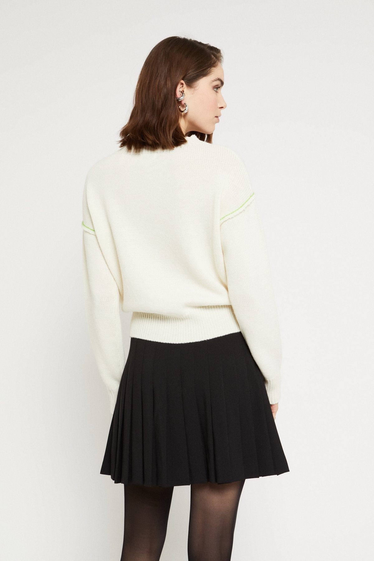 Wool blend sweater with raw edges,intarsia,and embroidery