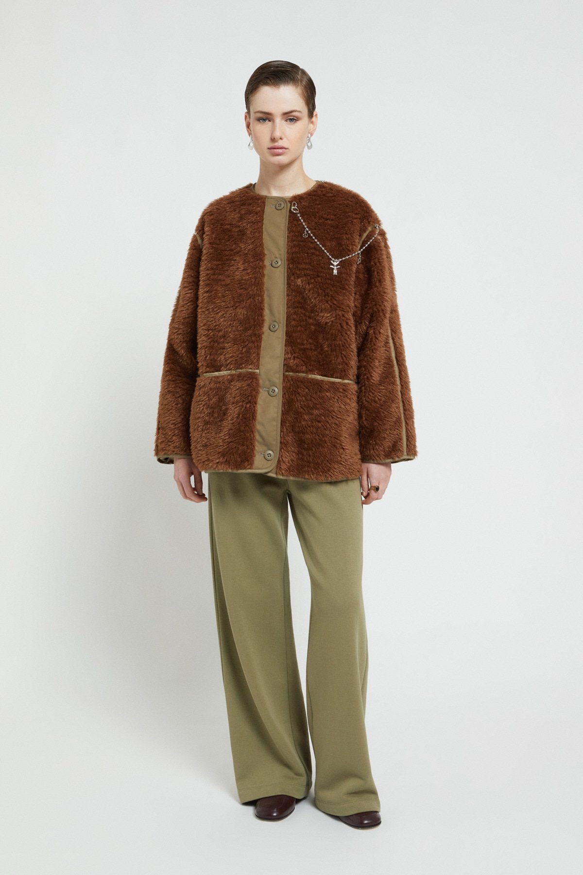 Fake fur jacket with chain