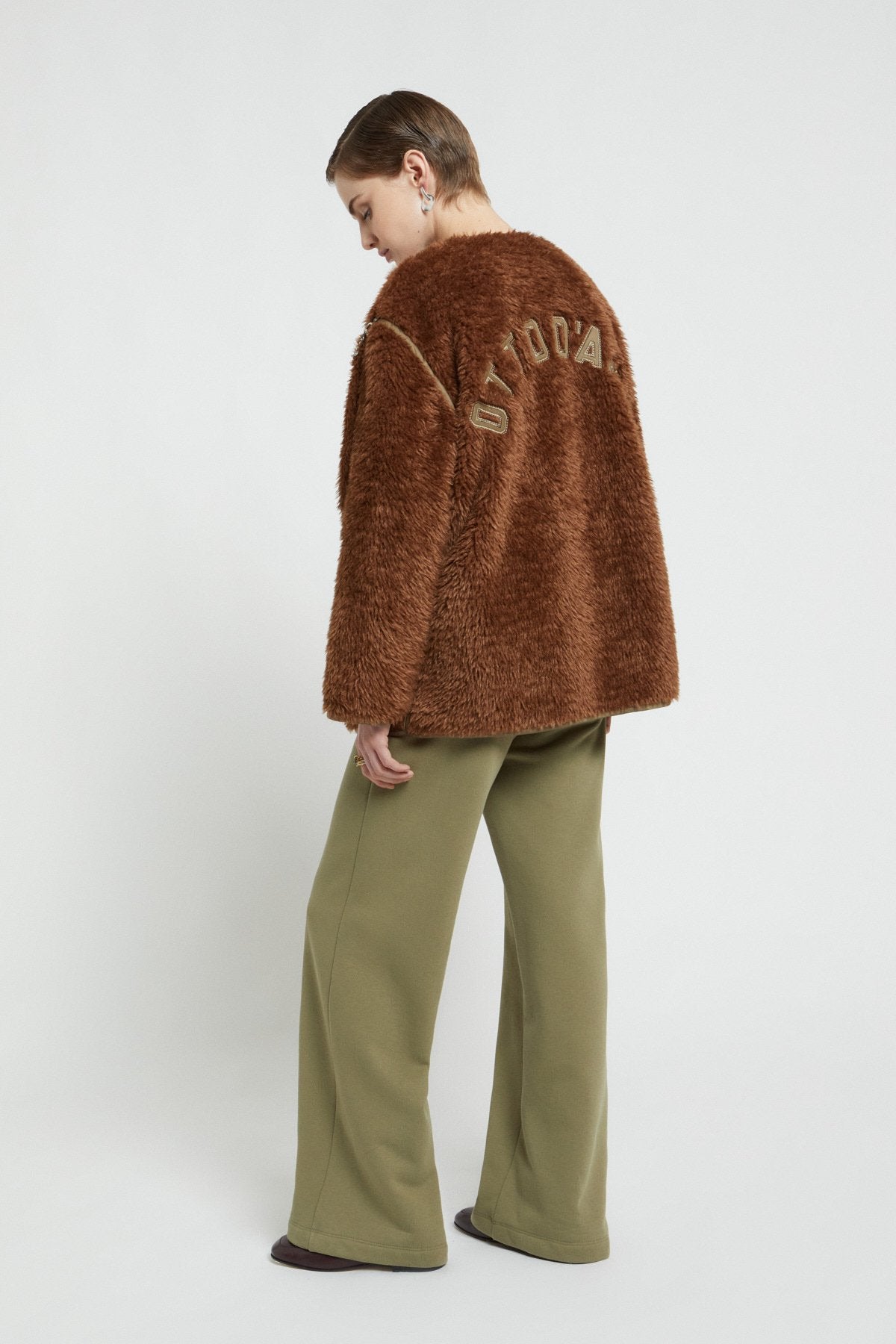 Fake fur jacket with chain