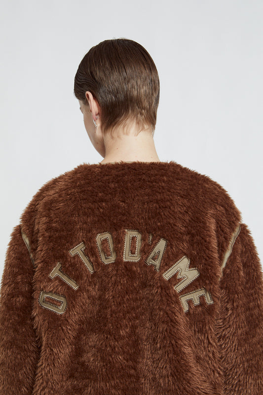 Fake fur jacket with chain